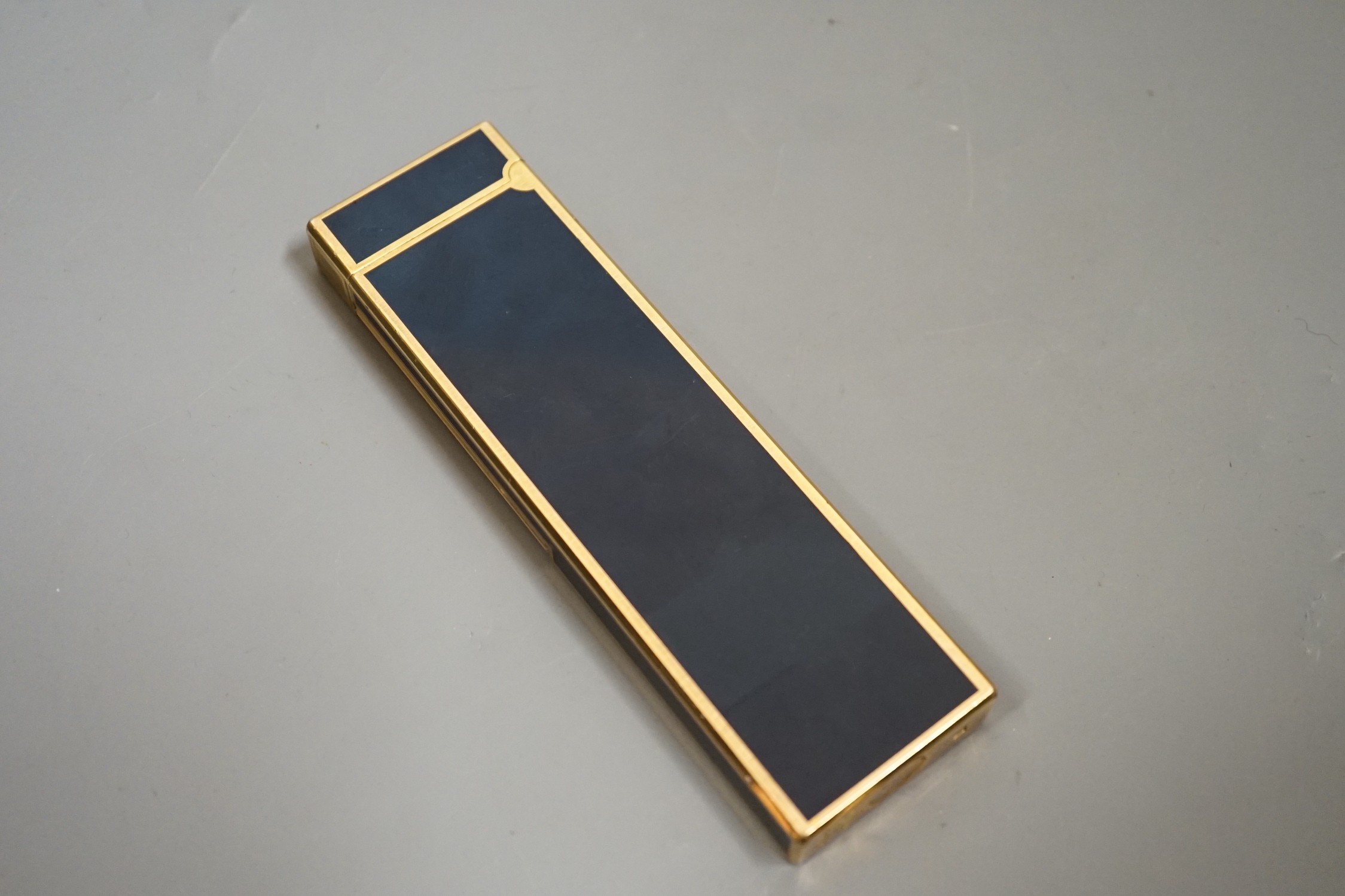 A Dupont gilt metal and blue enamel table lighter signed in Japanese, 14cm